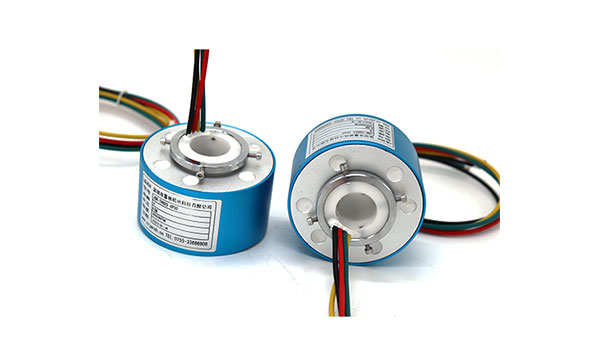 What are the main differences between a cap-type conductive slip ring and a via-hole conductive slip ring?